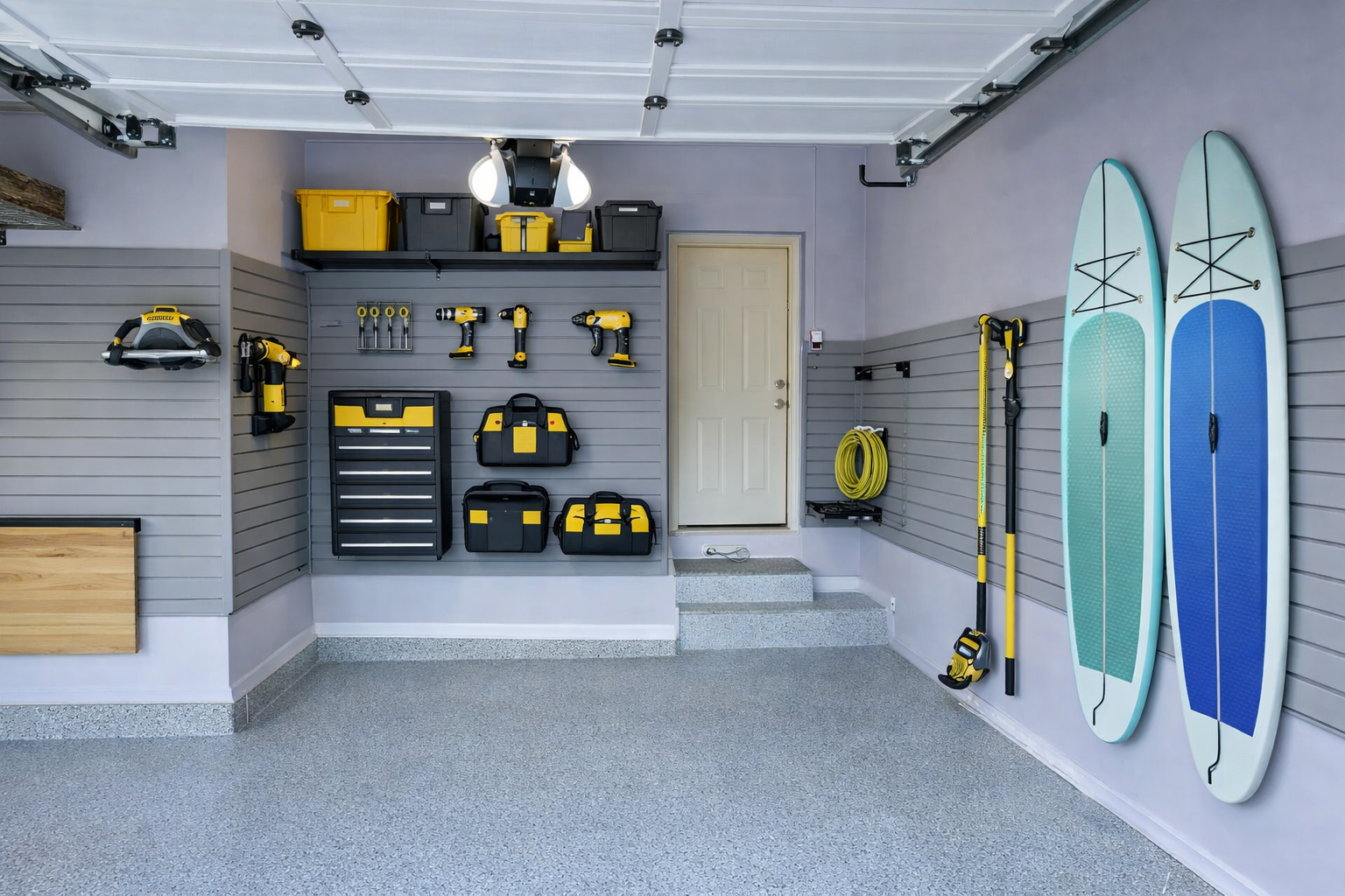 After garage transformation with organized tools on gray slatwall system, clean and functional garage design