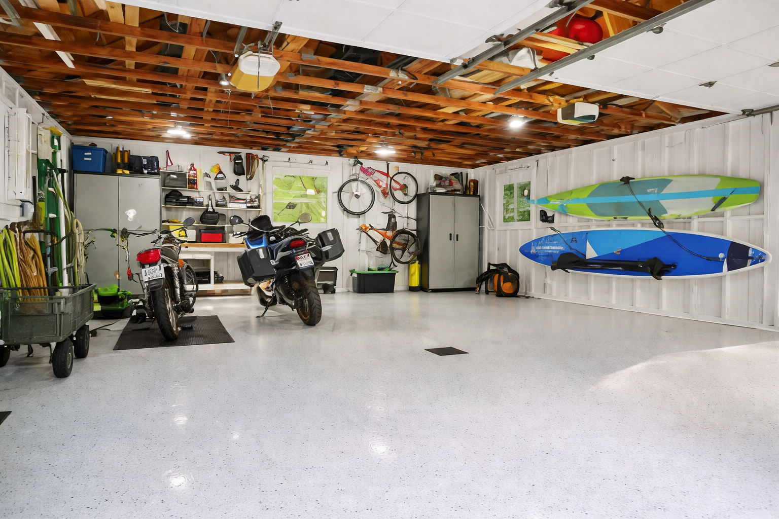 Before garage transformation, cluttered garage with tools and storage, no slatwall system