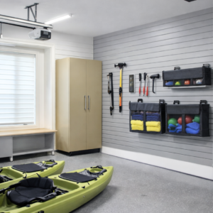 MR SLAT slatwall mesh storage bag on gray slatwall in organized garage, holds sports balls and towels