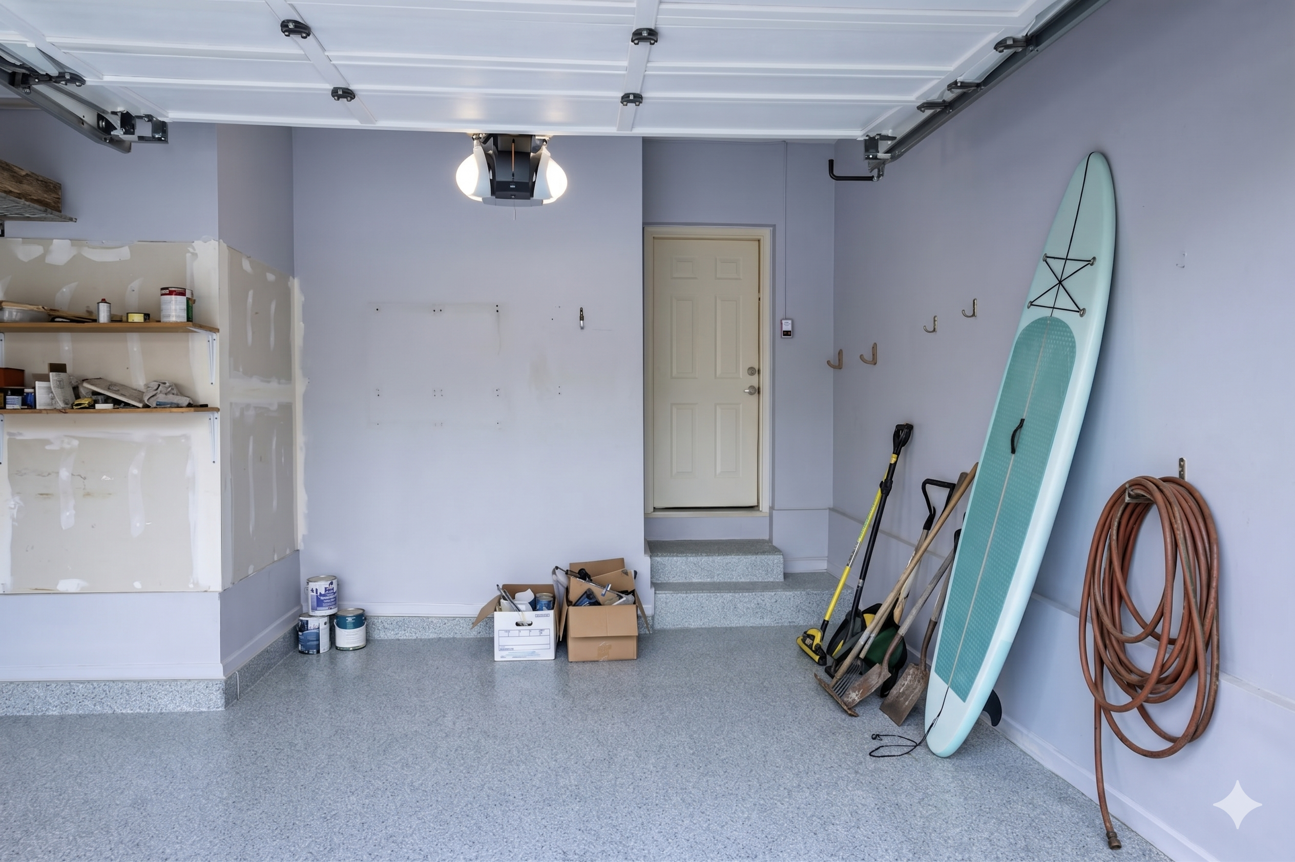 Before garage transformation, cluttered garage with tools and storage, no slatwall system
